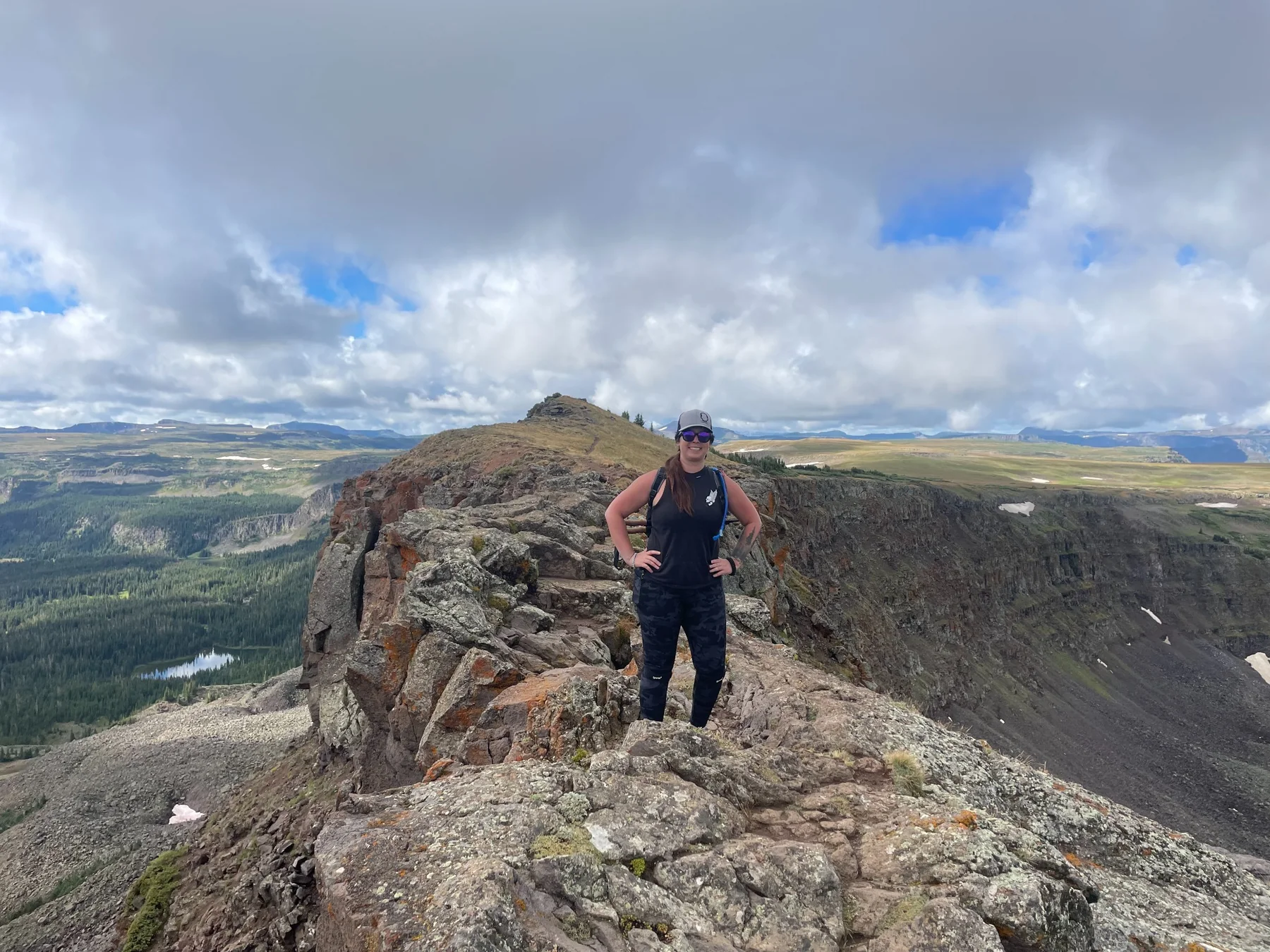 Stacey standing on the rocky Devil's Causeway trail in Colorado